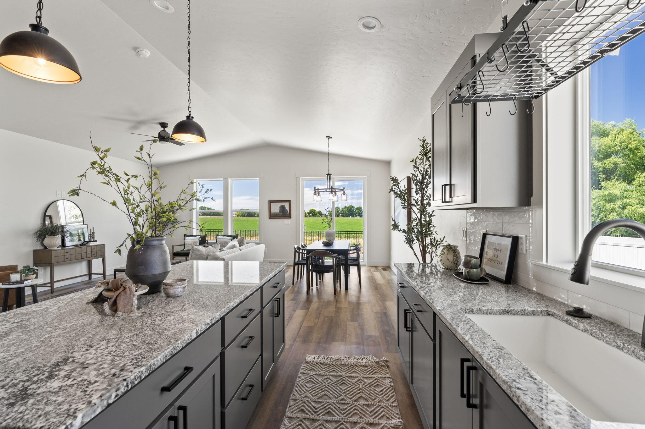 Open-concept kitchen and dining room in a Bear Homes build at Harvest Creek