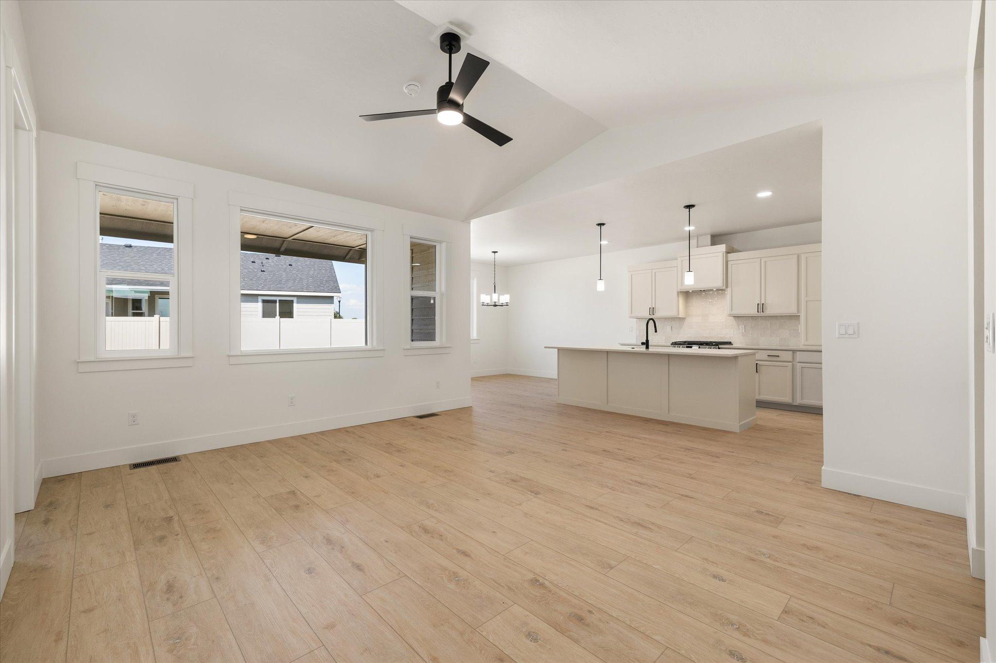Great room with nine foot ceilings and LVP flooring, open to the kitchen