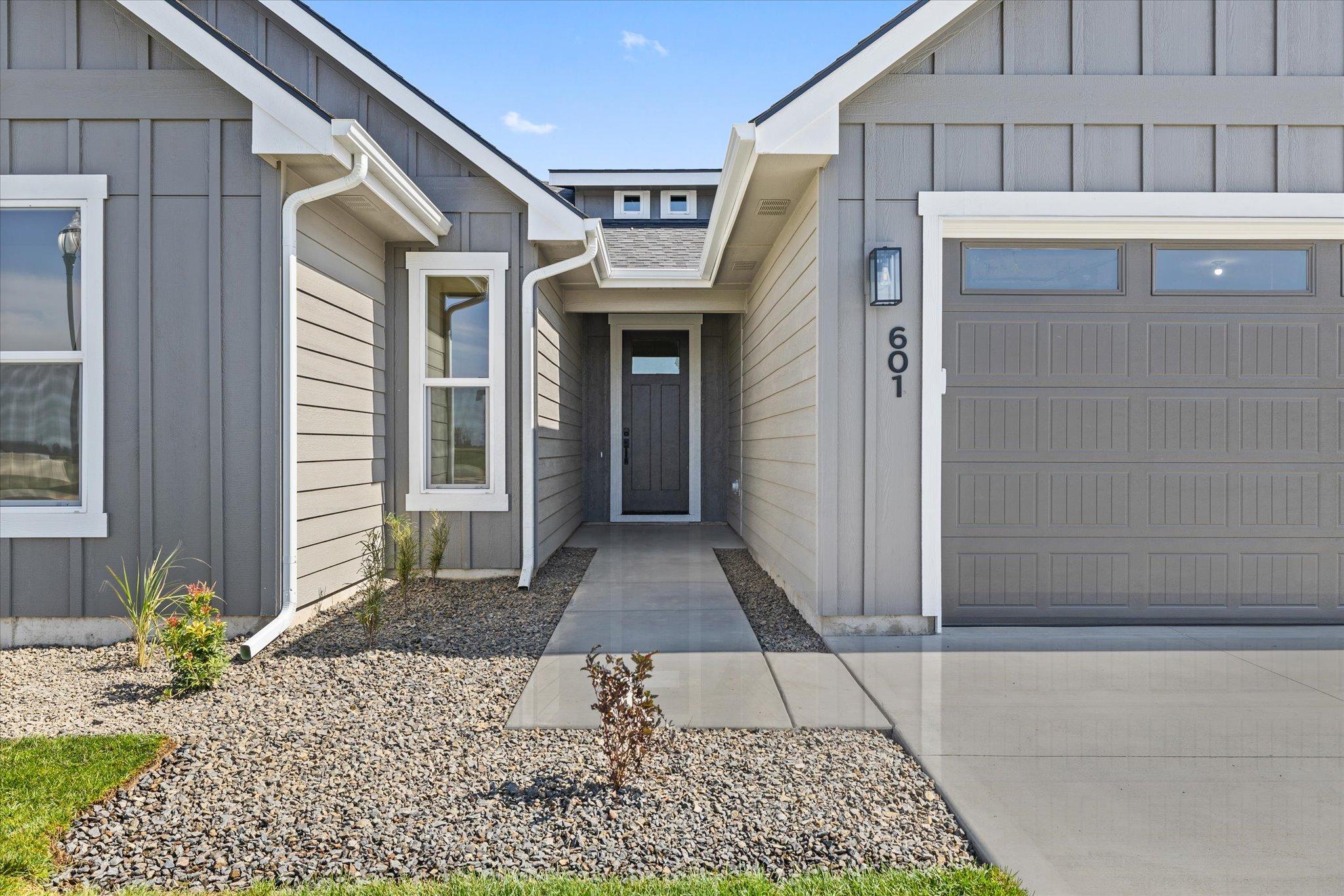 Covered front entry of 601 Grand Harvest Avenue