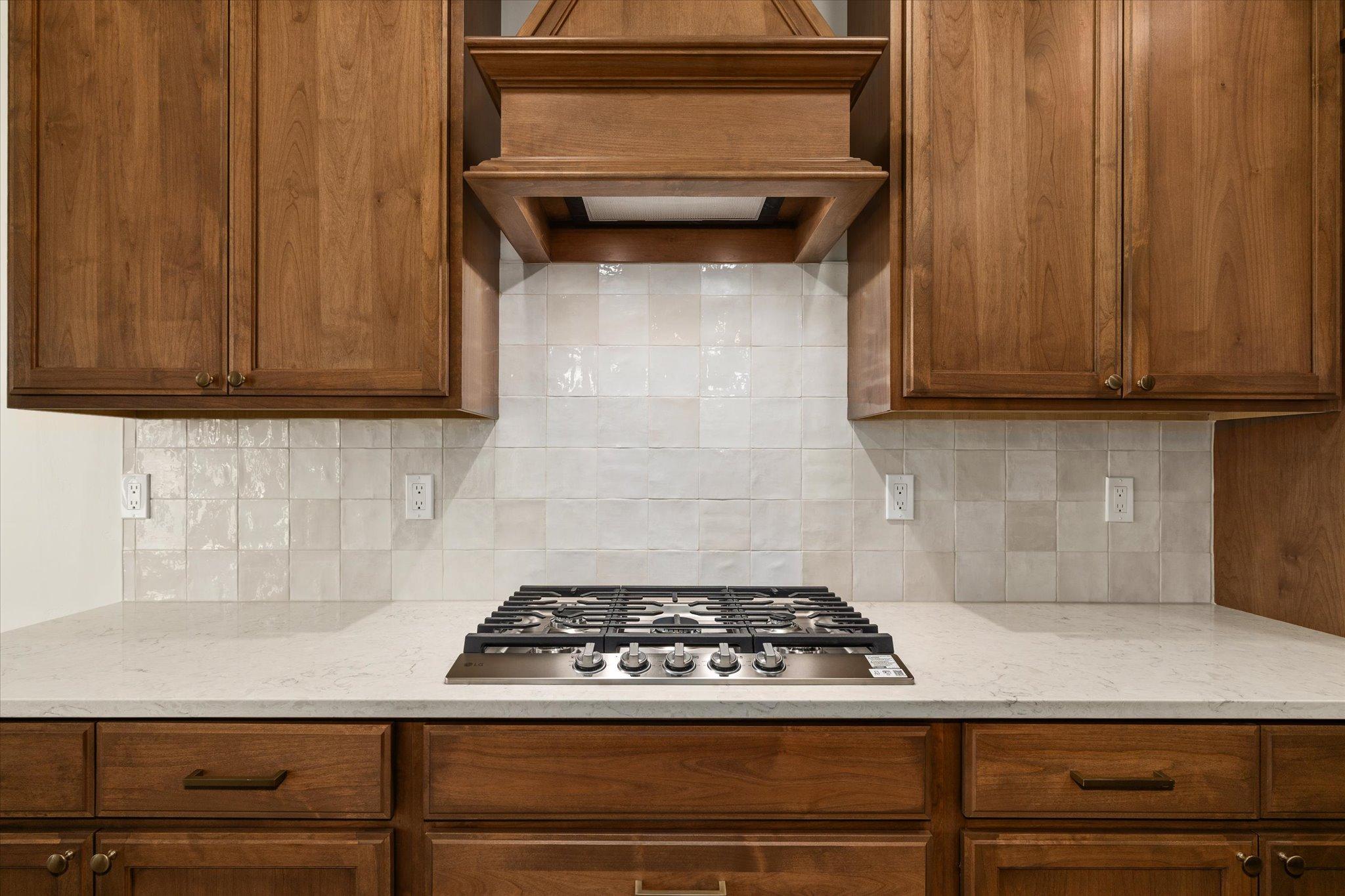 Kitchen range and backsplash at 601 Grand Harvest Avenue