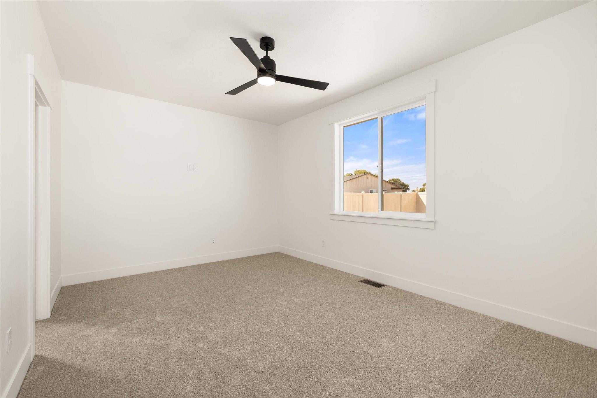 Primary bedroom at The Payette with Three-Car Garage