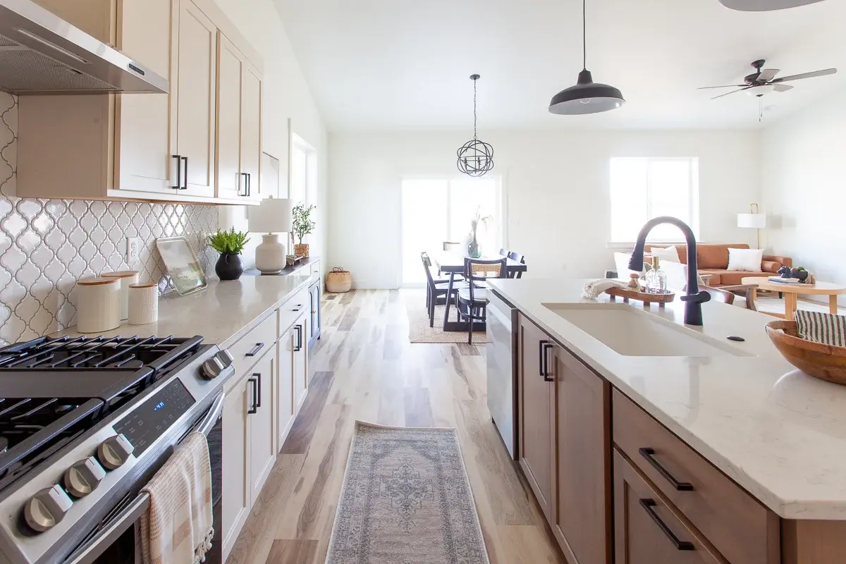 An open-plan Bear Homes kitchen and living area, representing Timberline finishes