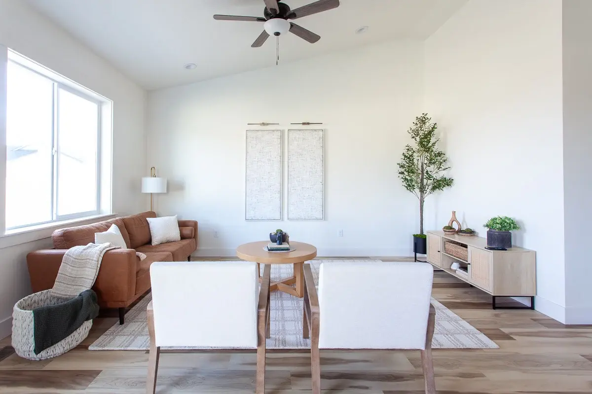 A Bear Homes living room with a vaulted ceiling, representing the finishes and details in the Timberline