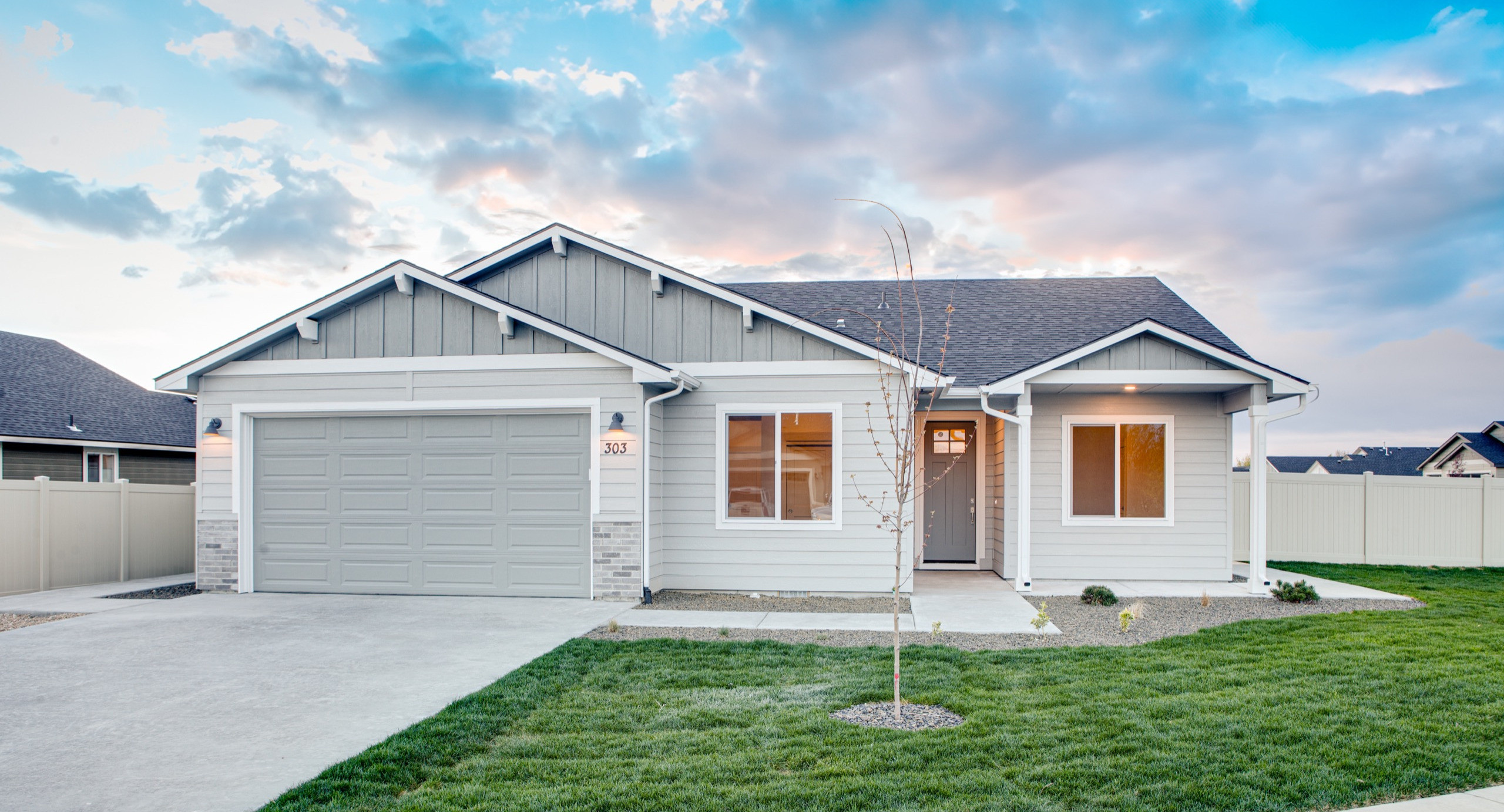 A Bear Homes craftsman-style home at dusk in the Treasure Valley, Idaho