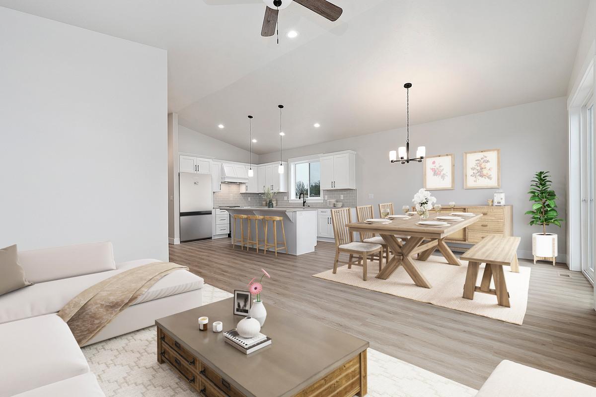 The open living, dining and kitchen area of the Payette floor plan by Bear Homes